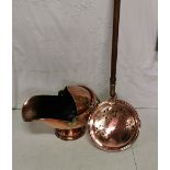 Copper helmet shaped coal bucket and a copper bed warming pan with handle, both nicely polished (2)