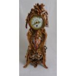 Ornate Miniature French Mantle Clock, in a scroll-shaped copper hued case, decorated with scrolls