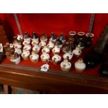 Collection of miniature Scotch whisky jars and Yorkshire Liqueur jars, with contents.