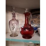Ruby glass decanter and clear glass decanter.