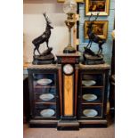 Victorian ebonised side cabinet with centre porcelain panel flanked by two glazed doors brass