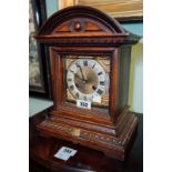 Edwardian oak bracket clock with silver and brass dial.