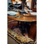 William IV mahogany breakfast room table on four turned columns and four out swept feet.