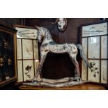 Carved painted pine rocking horse.