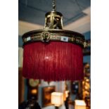Early 20th C. brass hanging lamp with fringe.