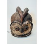 Very Old Helmet Mask (horns, pieced eyes, white pigment) probably Yoruba, Nigeria.