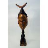 Magnificent Altar Mask with female face atop a crouching figure. Baule/Guru., Ivory Coast.