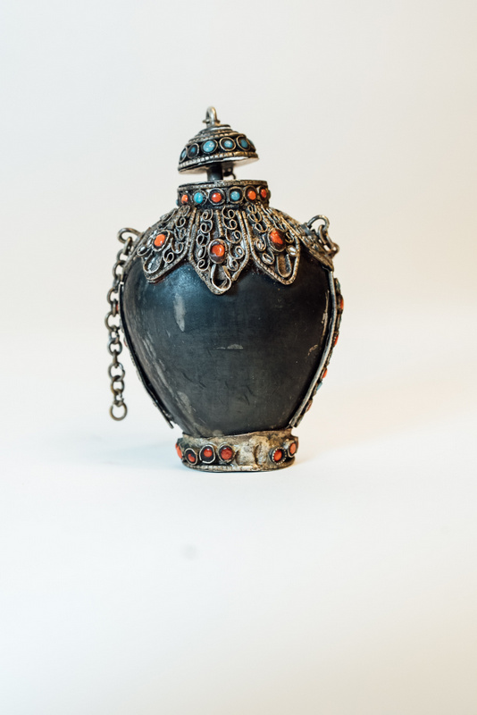 19th. C. Oriental rhinoceros horn scent bottle with white metal mounts.