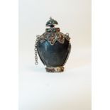 19th. C. Oriental rhinoceros horn scent bottle with white metal mounts.