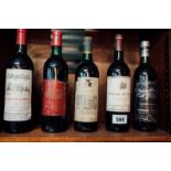 Five bottles of French vintage wine.