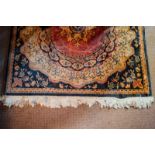 Decorative hand woven woollen rug. 186cm long x 119cm wide.