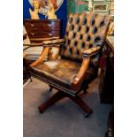 Mahogany and leather deep buttoned office swivel chair.
