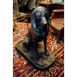 Good quality cast iron model of a seated dog {94 cm x 91 cm W x 40 cm D}.