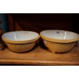 Two brown and white mixing bowls.