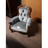 Mahogany framed and upholstered child's armchair.