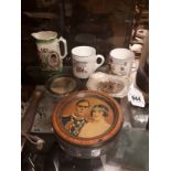 Four pieces of Coronation ware and two caricature jugs.