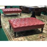 Ex Dylan Hotel A fine pair of red leather deep button central stools with studded embellishment