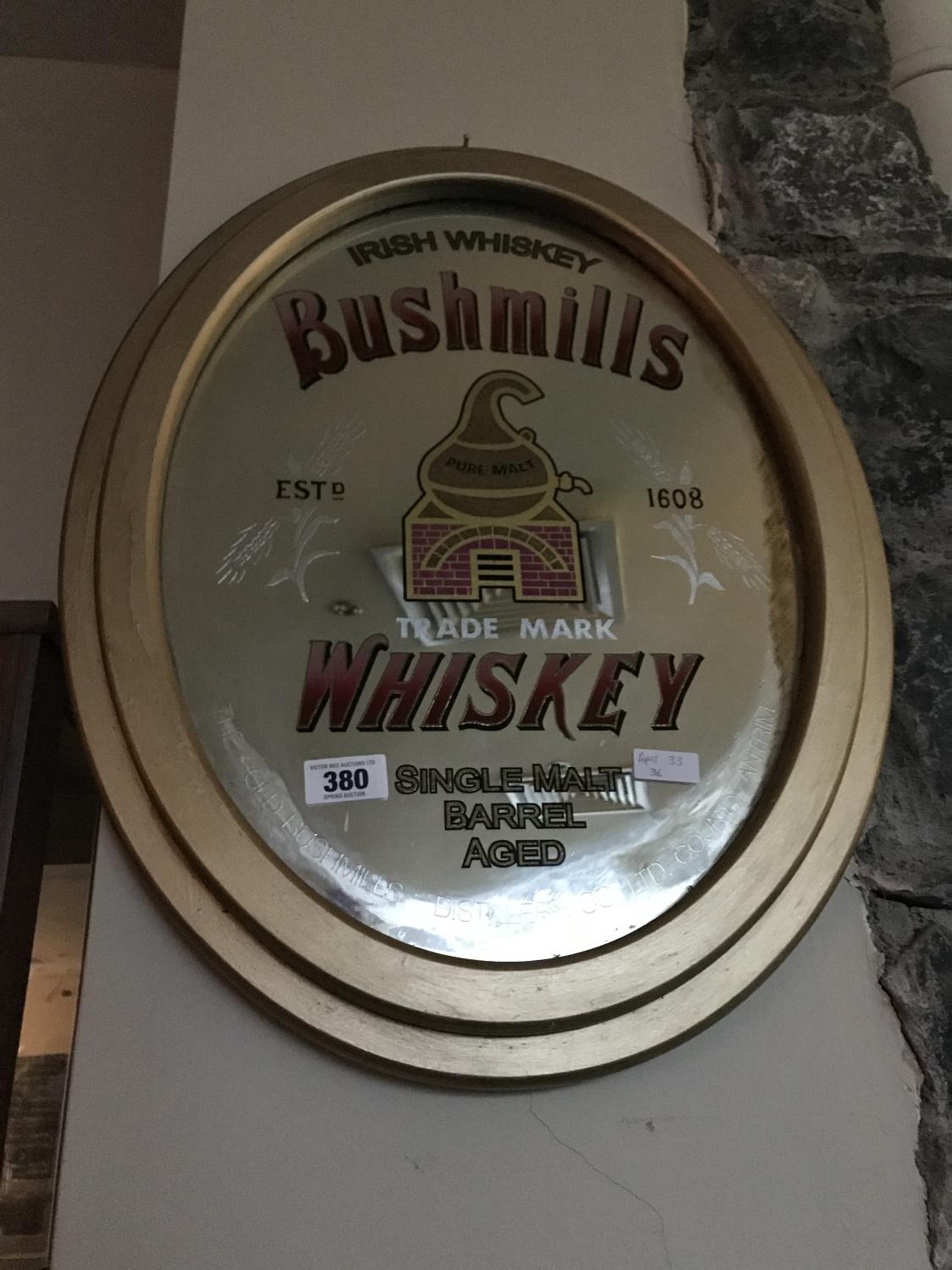 Oval Bushmills whiskey mirror 21" W x 27" H