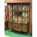 Fine mahogany Chippendale style display cabinet with inverted top above bow fronted base central