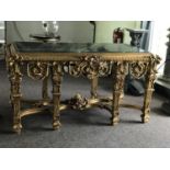 Elaborate gilt central console table with green marble top 69" W x 30"D x 36" H