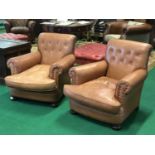 Ex Morrison Hotel a pair of deep button brown leather armchairs 34" W