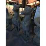 A pair of stone seated dogs 29" H