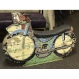 Hand painted carnival ride in the form of a motorbike