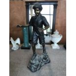 Fine bronze figure of a young boy on a rocky base 70" H