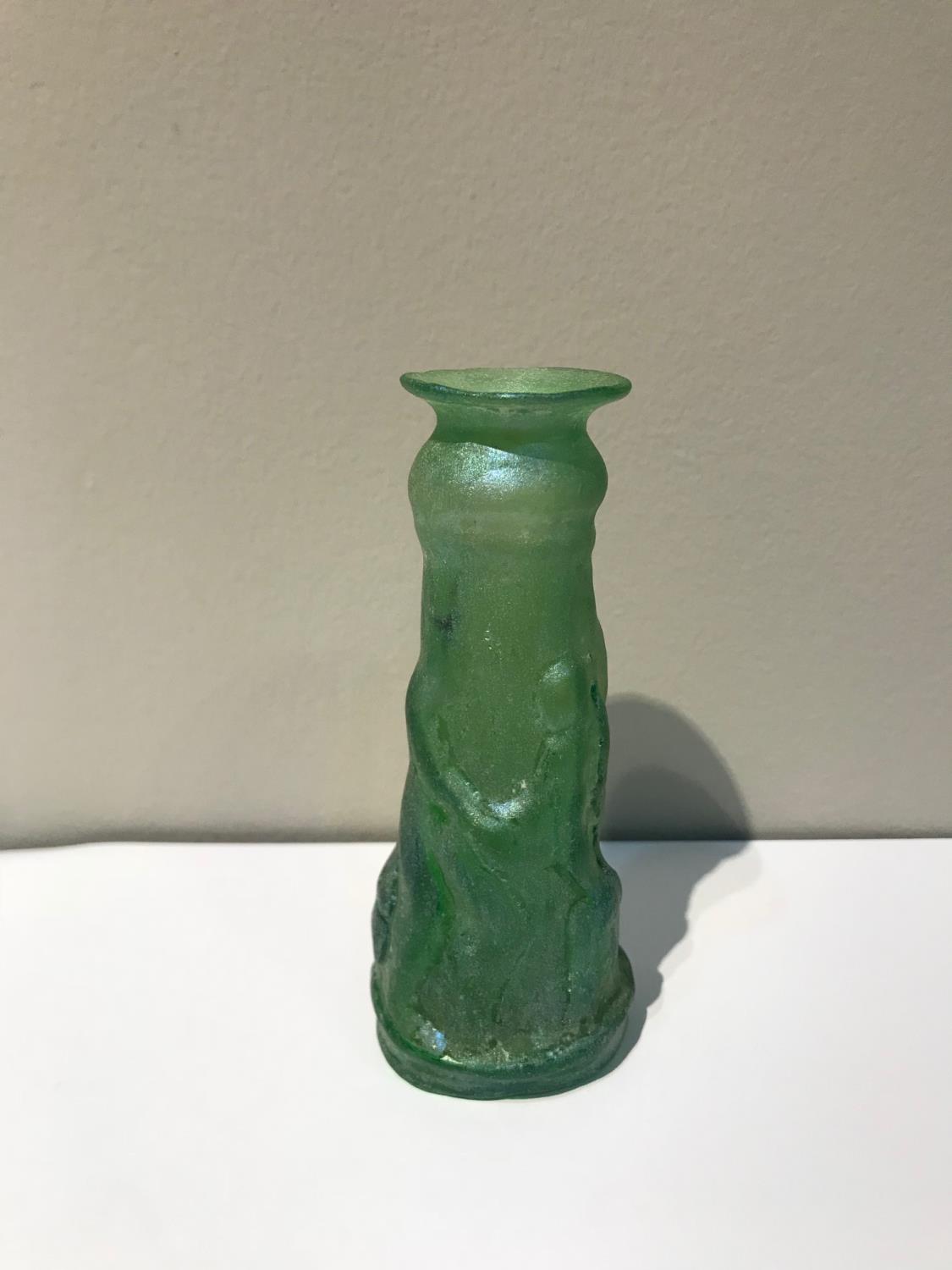 1st Century AD Roman bottle of wasted circular form featuring erotic scenes 2" W x 5" H