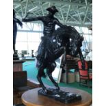 Bronze study cowboy on horse after Remington .