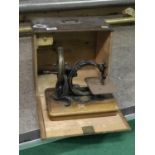 Cased miniature sewing machine