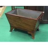 Georgian mahogany sarcophagus shaped wine cooler with floral inlaid design standing on splayed