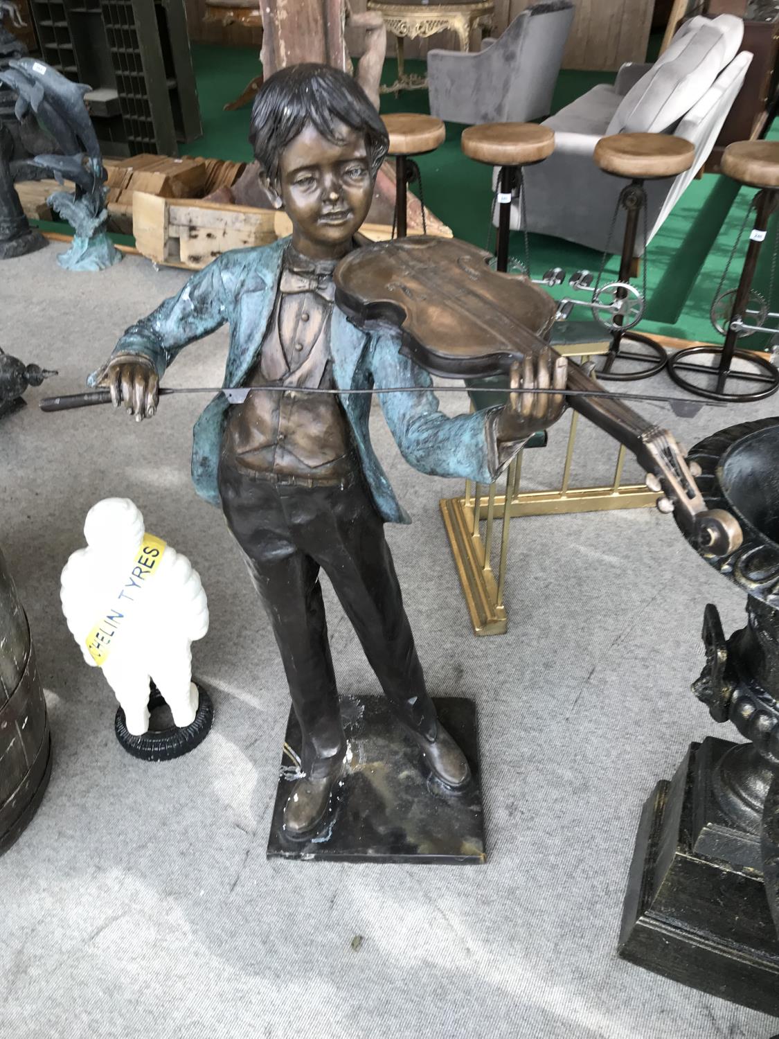 Bronze statue of a boy playing the violin 30" W x 50" H