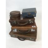 Collection of 1940's leather suit cases.