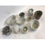 Collection of ten metal and ceramic jelly moulds.