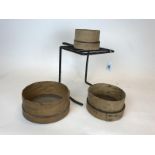 Early 20th C. griddle and three grain sieves.