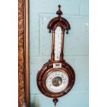 Edwardian carved oak barometer.