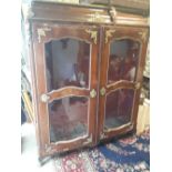 19th C. inlaid walnut and ormolou mounted French two door glazed cabinet.