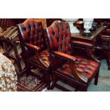 Pair of exceptional quality mahogany and ox blood leather library chairs.