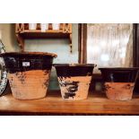 Set of three early 20th C. terracotta crocks.