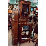 Edwardian mahogany music cabinet with two glazed doors and mirrored back raised on cabriole legs.