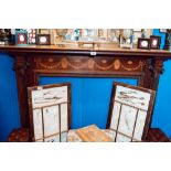 Early Victorian inlaid mahogany fire place with carved Corinthian columns.