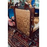 Edwardian carved mahogany fire screen.