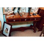 Early Victorian mahogany three draw side table on turned supports.