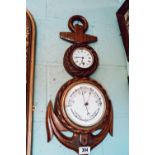 Edwardian carved oak barometer in the form of an anchor.