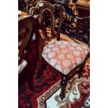 Set of eight mahogany and upholstered balloon back dining chairs in the Victorian manner.