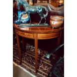 Edwardian inlaid mahogany demi-lune side table on squared tapered legs.