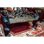 Exceptional hand carved oak black forest bench supported by bears.