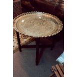 Early 20th C. hand etched brass table raised on turned legs and oak base.