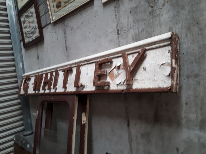 G WHITLEY shop name sign.